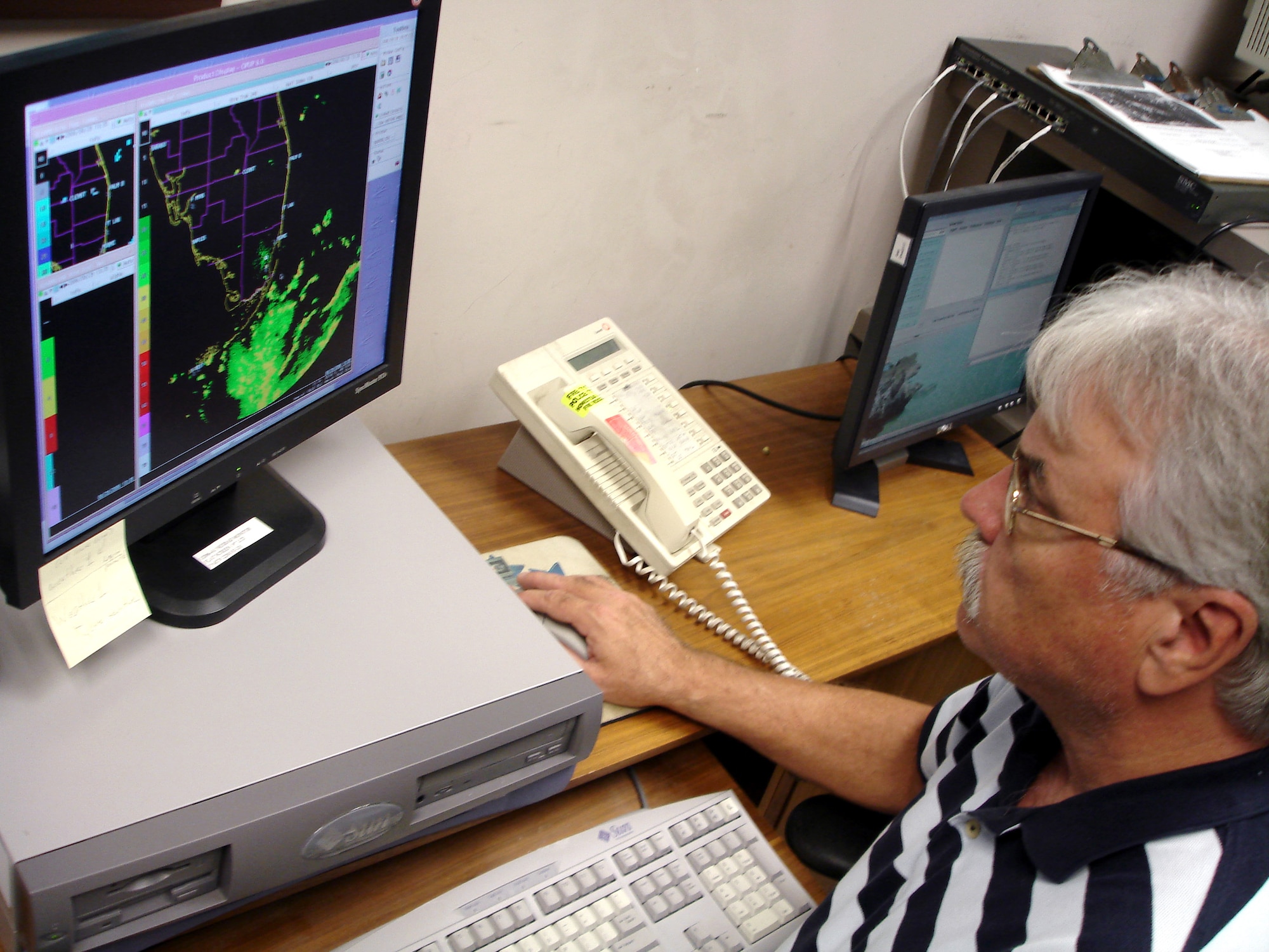 Ron Smith checks on the conditions of Tropical Storm Ernesto Aug. 29. The storm is expected to make landfall late this evening, while the base will see heavy thunderstorms and lightning by mid-afternoon. Reservists of the 482nd Fighter Wing have been preparing for the storm for several days. Mr. Smith is chief of weather operations at Homestead Air Reserve Base, Fla. (U.S. Air Force photo/Dan Galindo)
