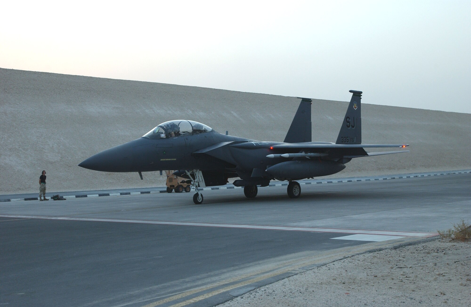 An F-15E Strike Eagle taxis from its protective bunker for a night combat mission over Iraq. The aircraft and crew are deployed to the 335th Expeditionary Fighter Squadron in Southwest Asia from Seymour Johnson Air Force Base, N.C. (U.S. Air Force photo/Master Sgt. John DeGroot) 