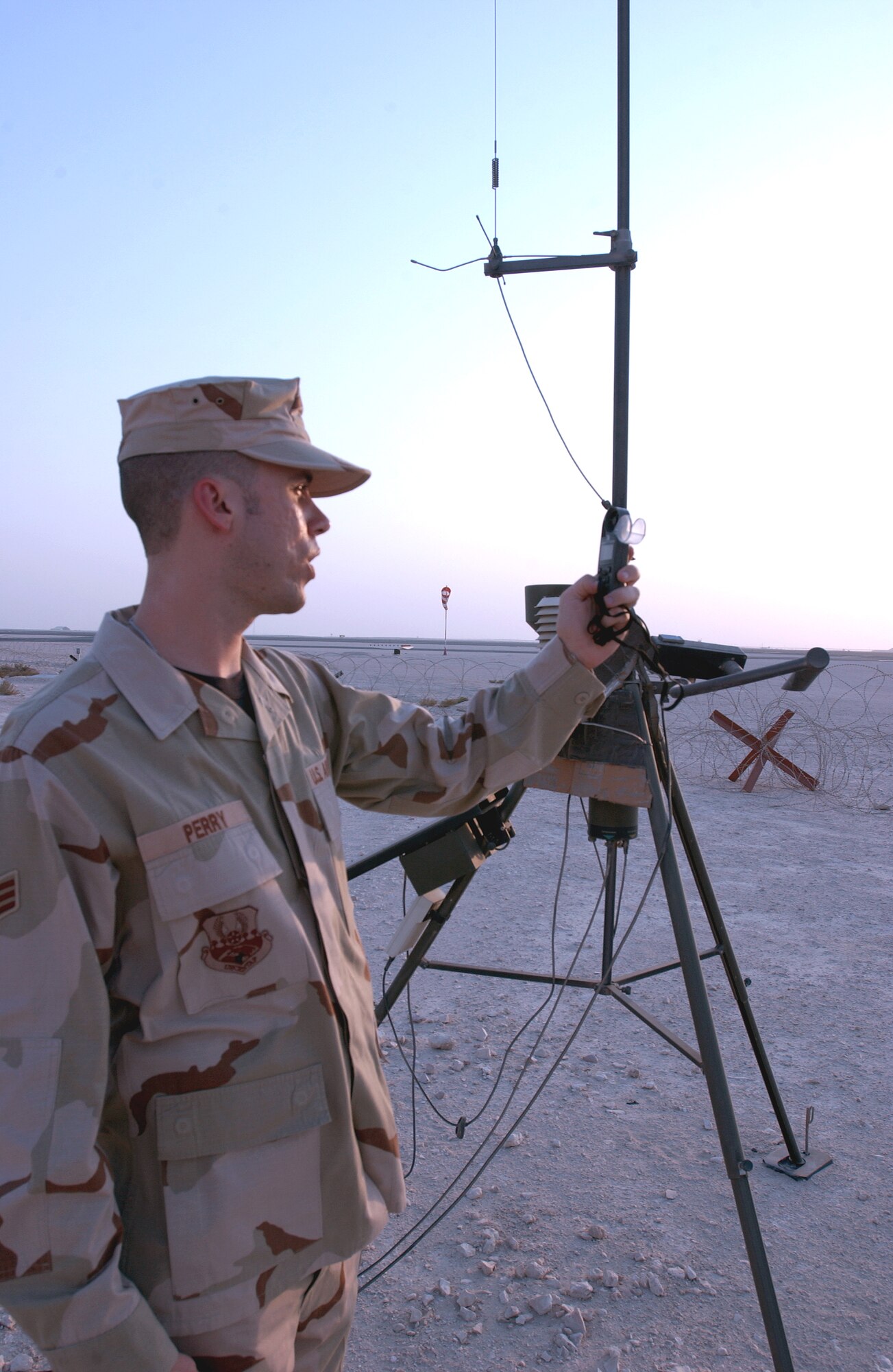 Senior Airman Daniel Perry takes a wind reading at a forward operating base in Southwest Asia Aug. 25. Airman Perry is a weather forecaster assigned to the 379th Expeditionary Operations Support Squadron and is deployed from Robins Air Force Base, Ga. (U.S. Air Force photo/Master Sgt. John DeGroot)