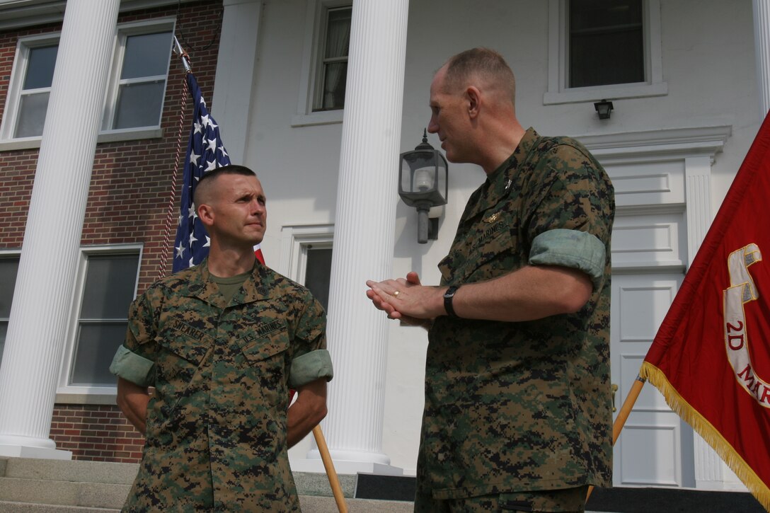 Gunnery Sgt. Kevin L. Shearer is commended by Col. Timothy C. Hanifen, the Assistant Wing Commander, 2nd Marine Aircraft Wing, for his beneficial suggestion to the Marine Corps, Aug. 30. Shearer, currently assigned to Marine Air Control Group 28, answered the call of duty while stationed at Marine Corps Logistics Base Albany, Ga., revitalizing obsolete radios for the new era.