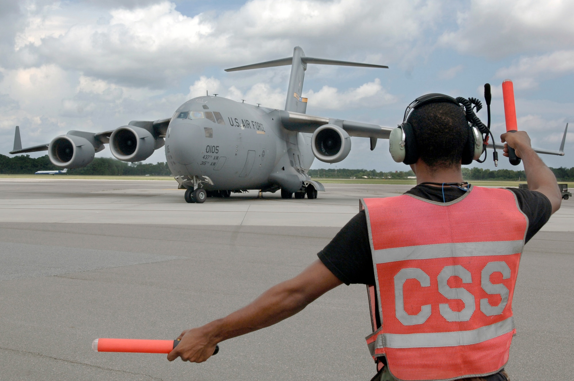 Senior Airman Marcus Lusk taxis out a C-17 Globemaster III Aug. 30 from Charleston Air Force Base, S.C. Airmen from Charleston AFB are in the process of evacuating all operational C-17 aircraft on station due to impending severe weather expected from Tropical Storm Ernesto. Airman Lusk is from the 437th Aircraft Maintenance Squadron. (U.S. Air Force photo/Airman 1st Class Nicholas Pilch) 