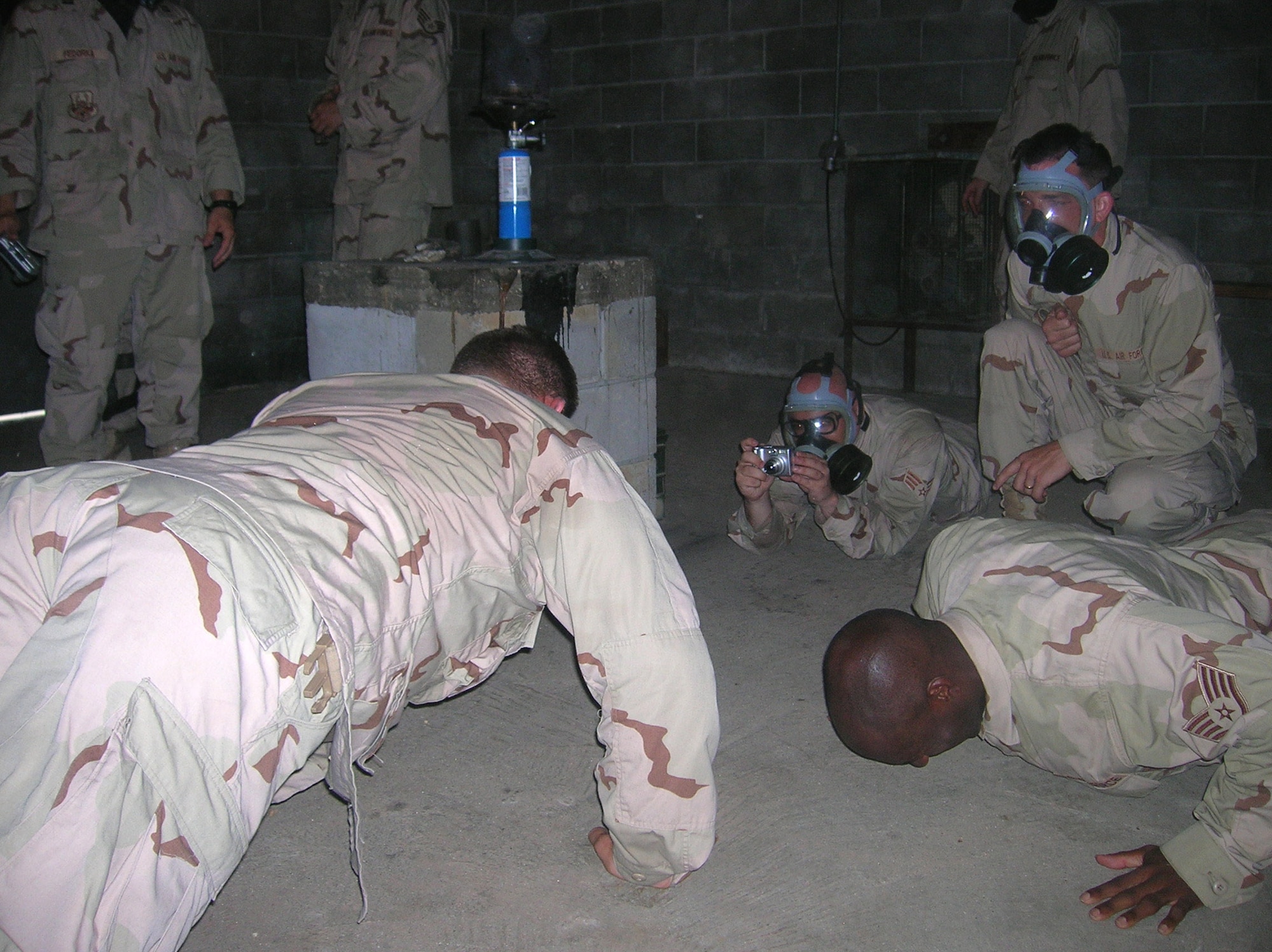 Air Force 1st Lt. Stephen Maddox broke a long-standing Army record for the number of push-ups completed in a gas chamber without wearing a mask Aug. 30 when he managed 165 before emerging from the chamber. (U.S. Air Force photo)