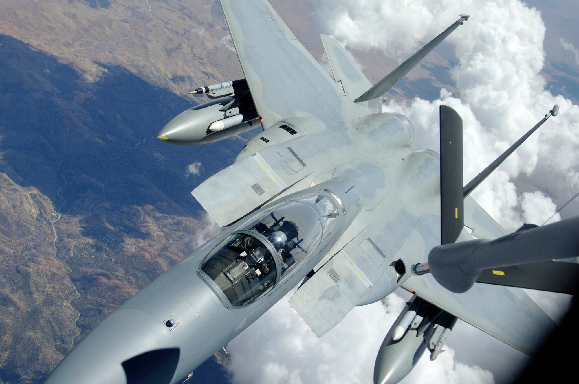 An F-15 Eagle from Kadena Air Base, Japan, pulls away from a KC-135 Stratotanker after refueling during Red Flag, a two-week exercise that tests and trains servicemembers in real-time combat situations at Nellis Air Force Base, Nev. Red Flag is conducted over the Nevada Test and Training Range, which has more than 2.9 million acres of airspace. The KC-135 is based at MacDill AFB, Fla. (U.S. Air Force photo/Senior Airman Travis Edwards)
