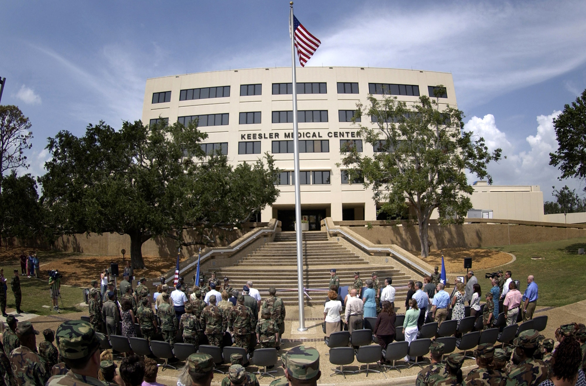 A group gathers for the ribbon-cutting ceremony at the Keesler Air Force Base, Miss., medical center Aug. 29, marking the transformation of the facility from an outpatient clinic to a fully functional hospital. (U.S. Air Force photo/Tech. Sgt. Cecilio Ricardo Jr.) 
