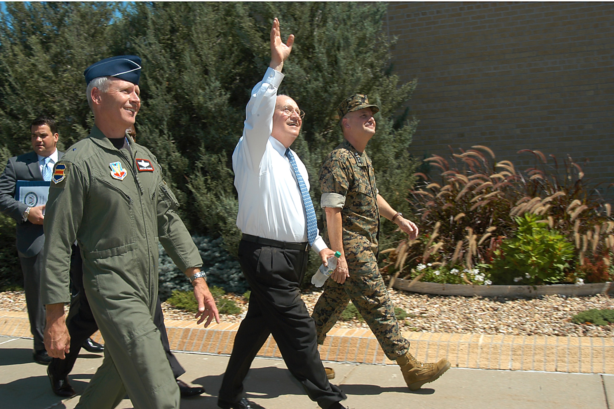 Vice President Dick Cheney waves to servicemembers while approaching the stage for a troop call at Offutt Air Force Base, Neb., Aug. 29. Offutt is home to the U.S. Strategic Command headquarters and the 55th Wing.  Accompanying Mr. Cheney is Marine Gen. James E. Cartwright (right), STRATCOM commander, and Brig. Gen. Jonathan George, 55th WG commander. (U.S. Air Force photo/Steve Cunningham)