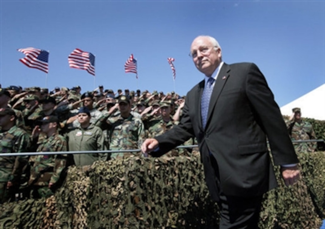 Military personnel salute Vice President Dick Cheney upon his arrival at a rally for the troops, Aug. 29, 2006, at Offutt Air Force Base in Omaha, Neb. Offutt is home to the U.S. Strategic Command Headquarters and the Fighting 55th Wing, the largest wing in the Air Combat Command and the second largest in the Air Force. 