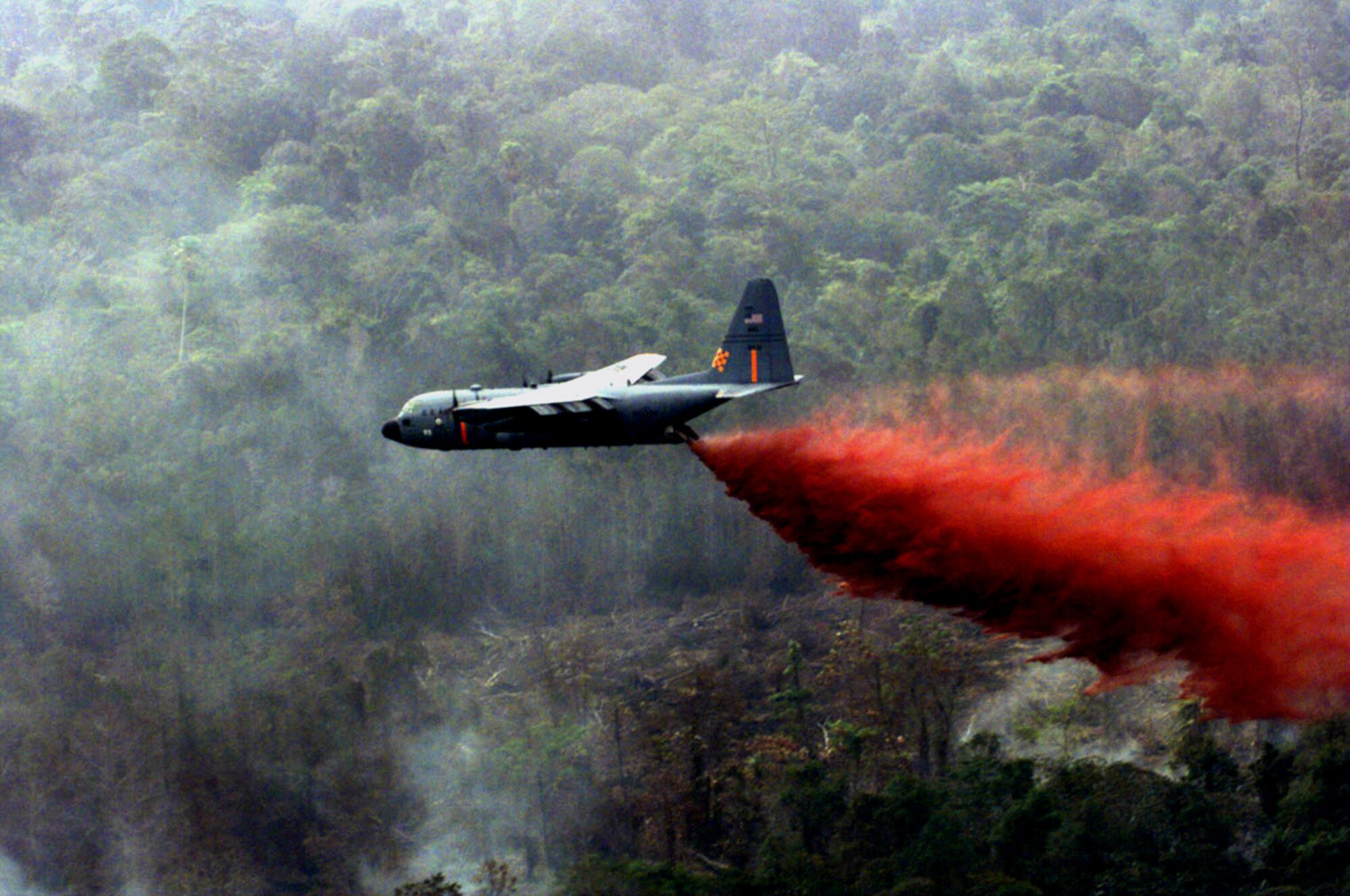 Air Force Reserve aircrews and maintainers stand ready to fight wildfires using C-130 Hercules equipped with modular airborne firefighting systems, similar to this one.  The aircraft can drop up to 3000 gallons of retardant covering an area one-quarter of a mile long and 60 feet wide. (File photo)