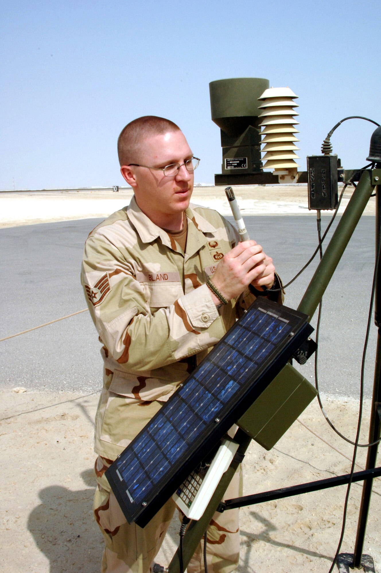 Staff Sgt. Levy Bland performs a preventative maintenance inspection on weather equipment in Southwest Asia. Sergeant Bland is a weather forecaster with the 380th Expeditionary Operations Support Squadron. (U.S. Air Force photo/Staff Sgt Jason Webb)
