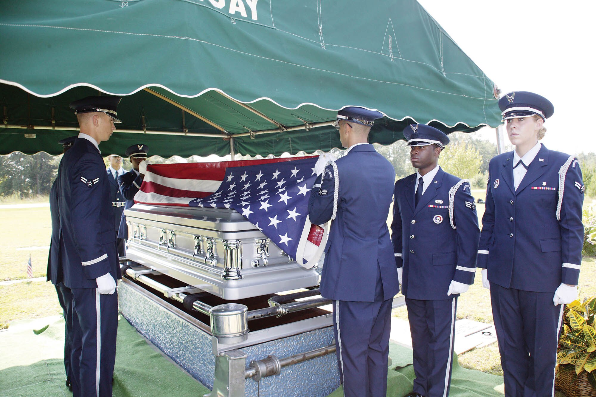 The Shaw Honor Guard detail begins the flag folding ceremony, which requires six members, at the beginning of a retired servicemember’s funeral service Tuesday.   (U.S. Air Force photo/Senior Airman Holly MacDonald)