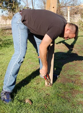 Senior Master Sgt. Bob Hoeppner, 376th Expeditionary Operations Group superintendent, tightens a bolt on the new swing set before it’s cemented into the ground. Members of both the 376th Air Expeditionary Wing and EOG visited the Solnyshko Kindergarten School Nov. 16 to complete the swing set for the children. Sergeant Hoeppner is deployed from 56th Airlift Squadron at Altus Air Force Base, Okla. (U.S. Air Force Photo/Capt. Christy Stravolo)  