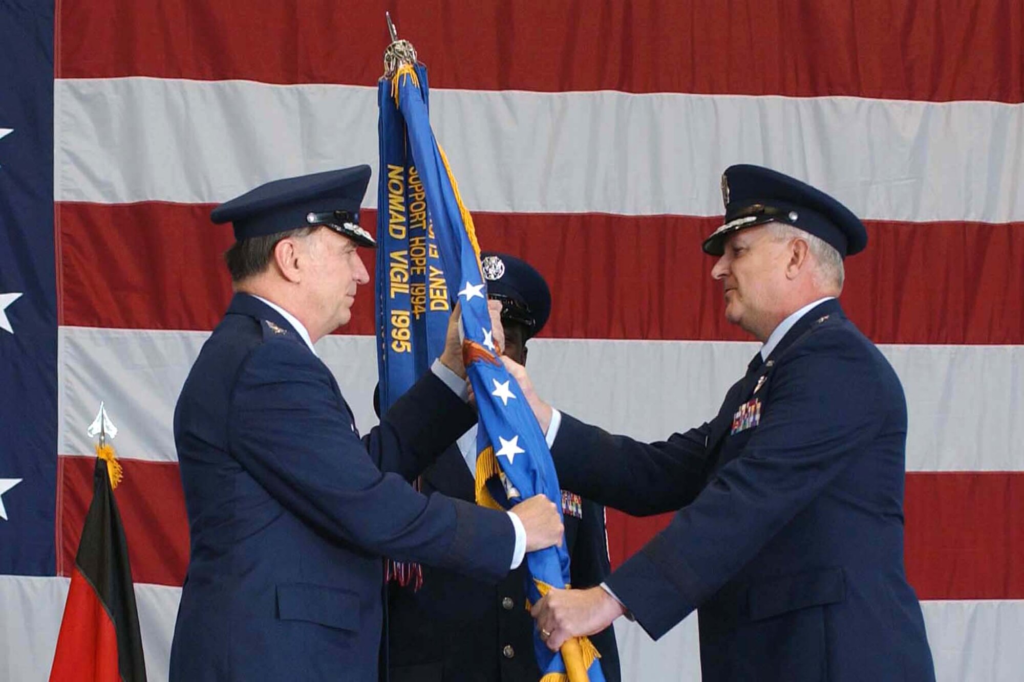 With the inactivation of 16th Air Force and the reactivation of 3rd Air Force, Maj. Gen. Paul J. Fletcher (right), 16th Air Force commander, relinquishes command, passing the 16th AF flag to Gen. William T. Hobbins, U.S. Air Forces in Europe commander, during the reactivation ceremony at Ramstein Air Base, Germany, Dec. 1.  The responsibilities of 16th AF will be assumed by 3rd AF.  (U.S. Air Force photo/Senior Airman Megan M. Carrico)