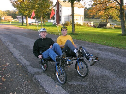 Stephen Boyd, left, a former member of the 341st Missile Maintenance Squadron, and his father, David Boyd, enjoy a ride on their tandem recumbent bike through the streets of his hometown, Mayville, N.Y.