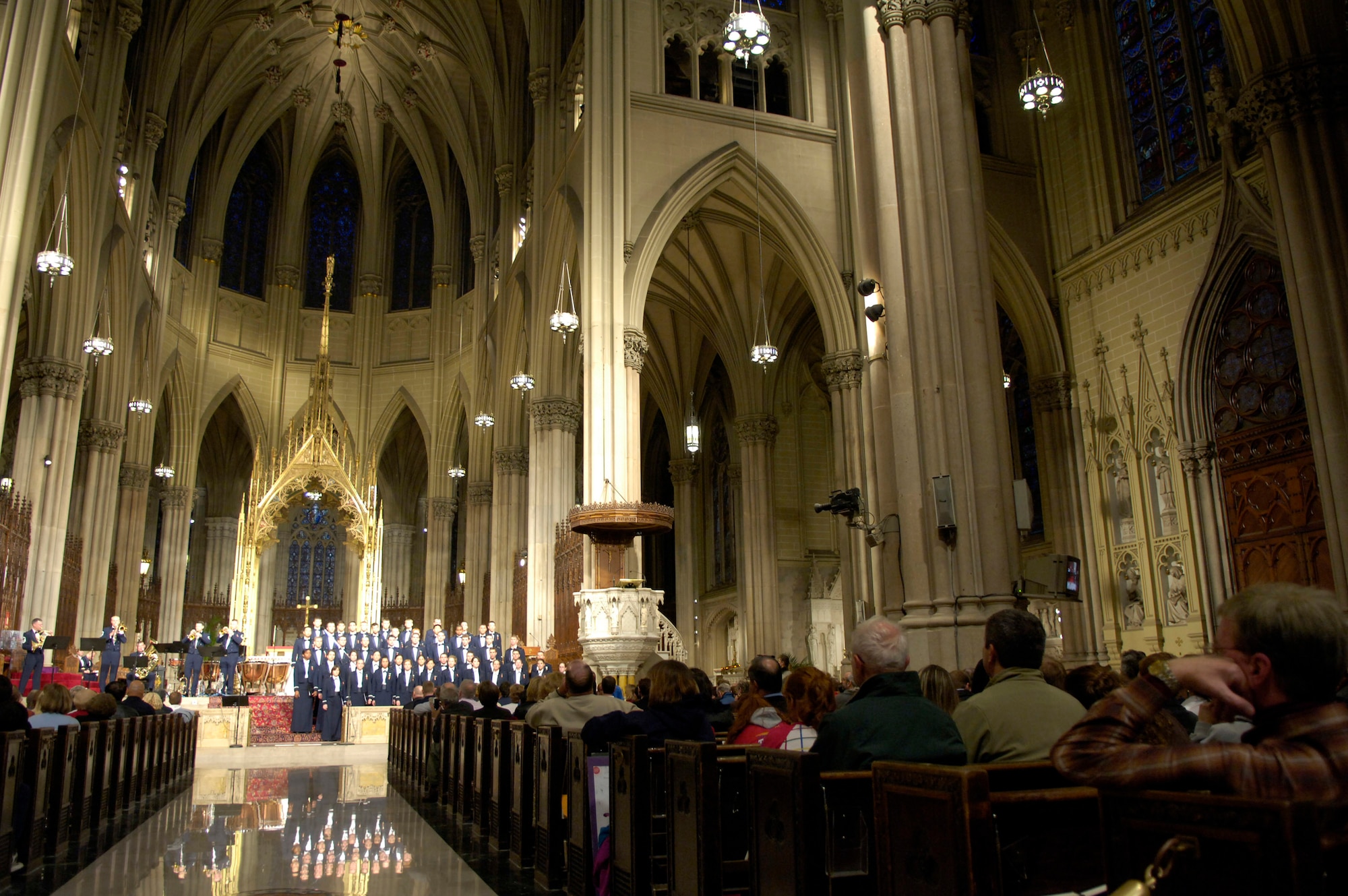 The Stellar Brass Band along with the Cadet Chorale play and sing holiday songs for visitors during a concert at St. Patrick's Cathedral Nov. 24 in New York. The band and the chorale are part of the U.S. Air Force Academy Band, here to raise Air Force awareness and celebrate the Air Force's 60th year. (U.S Air Force photo/Senior Airman Brian Ferguson) 
