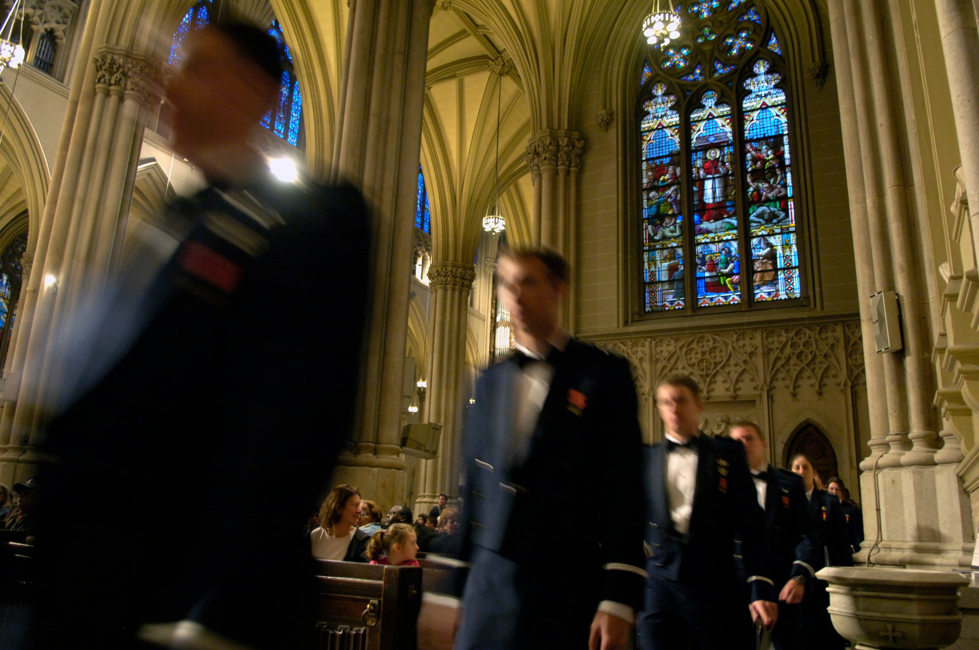 Members of the Stellar Brass Band along with the Cadet Chorale enter the St. Patrick's Cathedral Nov. 24 in New York to sing holiday songs for visitors during a concert. The band and the chorale are part of the U.S. Air Force Academy Band, here to raise Air Force awareness and celebrate the Air Force's 60th year. (U.S Air Force photo/Senior Airman Brian Ferguson) 

