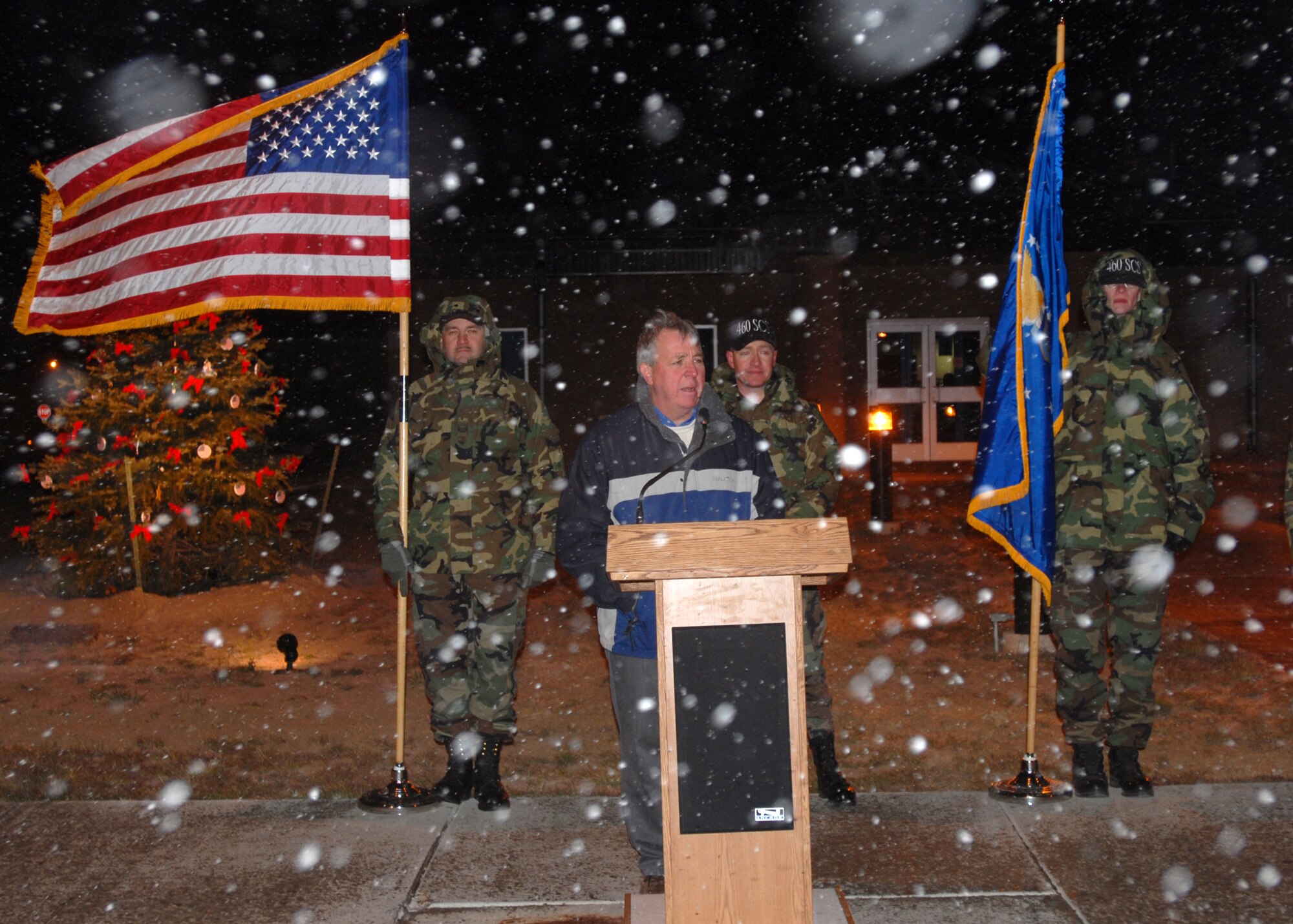 Mr. Craig Mansfield, father of the 460th Space Communications Squadron's Senior Airman Chris Mansfield, warns the 460th SCS tree lighting ceremony audience members of the dangers of drinking and driving Nov. 29. Mr. Mansfield lost his son to a drunk driver about two years ago. The SCS lights the tree in honor of Airman Mansfield. (U.S. Air Force photo by Airman 1st Class Michelle Cross)