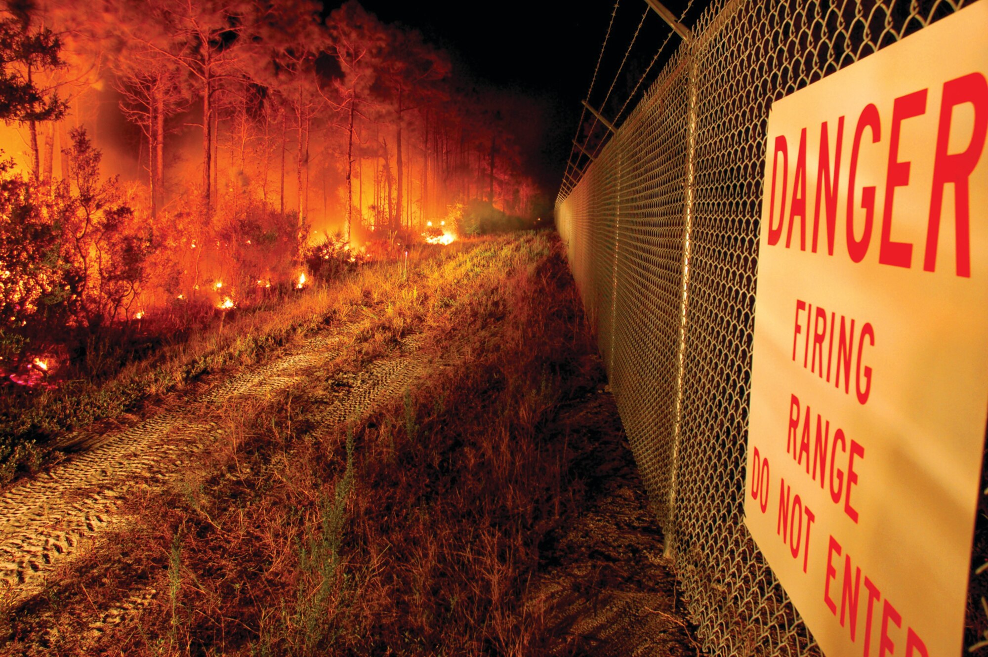 TYNDALL AIR FORCE BASE, Fla. --  A control burn border runs parallel with the fence line of the base firing range. Fire borders are established so flames do not spread beyond the intended "line of fire." (U.S. Air Force photo by Tech. Sgt. Edward Gyokeres)