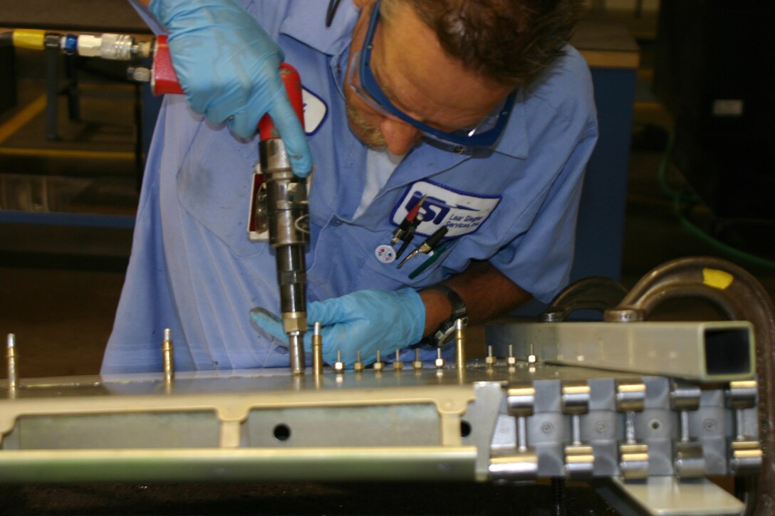 Michael Gray works on the aileron of a T-38 Talon at the 80th Flying Training Wing. Mr. Gray and other sheet metalists ensure the integrity of the airframes are maintained. (U.S. Air Force photo/Robert Fox)