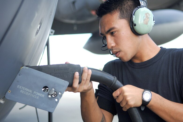 Airman 1st Class Philip Yago connects a plug to the external power receptacle of an HC-130P Nov. 28 at Moody Air Force Base, Ga. The 723rd Maintenance Group recently conducted a two-day meeting to find efficiencies and cut waste from the C-130 Hercules isochronal inspection process. Airman Yago is a 723rd Aircraft Maintenance Squadron crew chief. (U.S. Air Force photo/Airman 1st Class Schelli Jones)