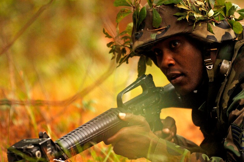 Staff Sgt. Donovan Bryan, 437th Logistics Readiness Squadron, takes cover during expeditionary combat skills training at Charleston Air Force Base, Nov. 16, 2006.  Expeditionary combat skills training is a three day tactical operations course preparing Air Force personnel for future deployment.  (U.S. Air Force photo by Staff Sgt. Sarayuth Pinthong)(Released)