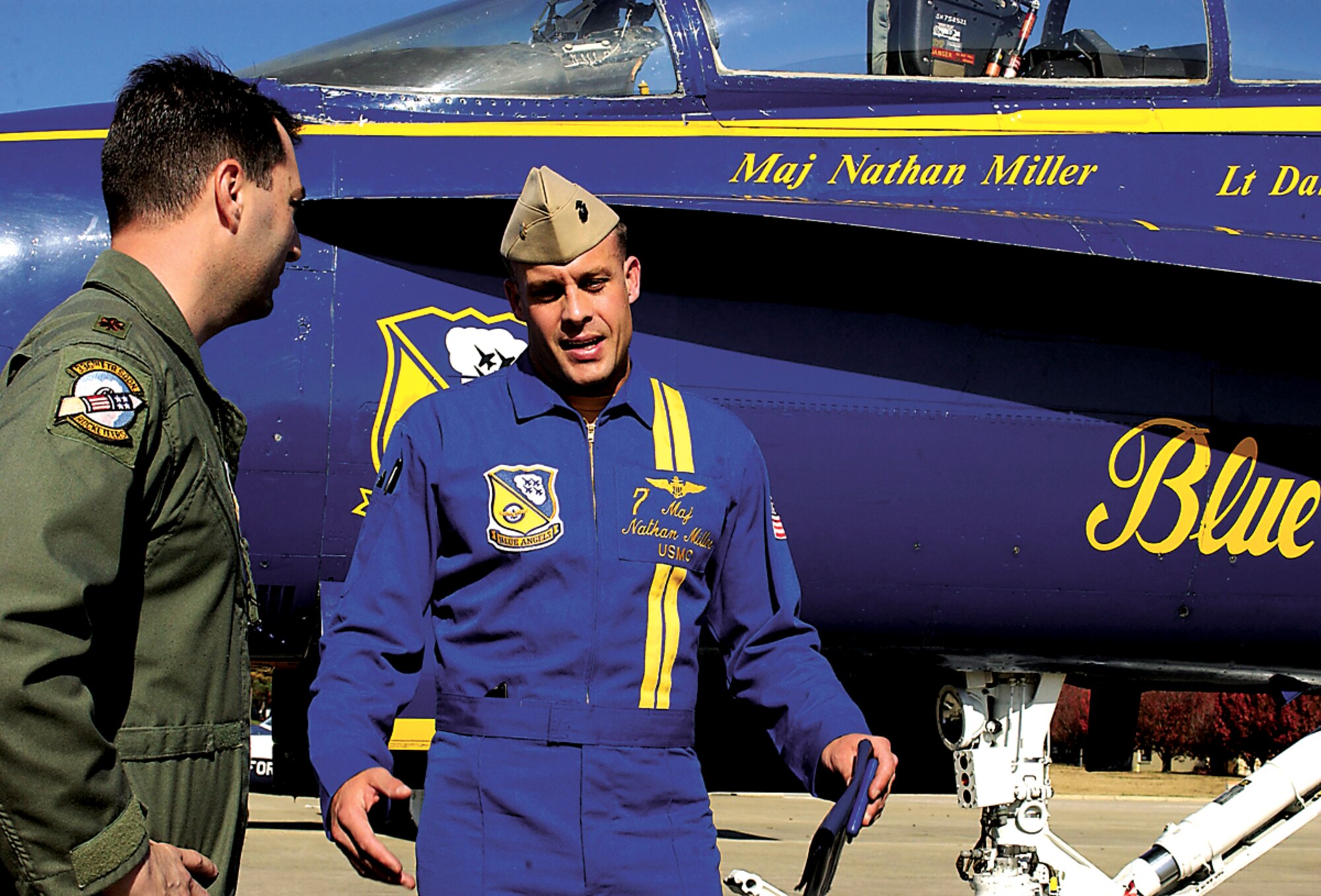 SEYMOUR JOHNSON AIR FORCE BASE, N.C. - Major Jeff D?Ambra, 336th Fighter Squadron Liaison for Blue Angels, welcomes #7 Navy Maj. Nathan Miller, Air Show narrator for the Aerial Demonstration Team Blue Angels, during a site visit of the base. The site visit is one of the final steps in the decision-making process for the Blue Angels choosing which bases to add to the team?s 2007 air show calendar. Major Miller and team?s event coordinator #8 Navy Lt. Dan McShane spent the day with air show committee members gathering information and visiting base facilities. The official decision will be announced following the International Council of Air Shows conference next week. Airshows provide an opportunity for the public to get an up-close look at America?s air power.  (U.S. Air Force photo by Staff Sgt. Les Waters)                               