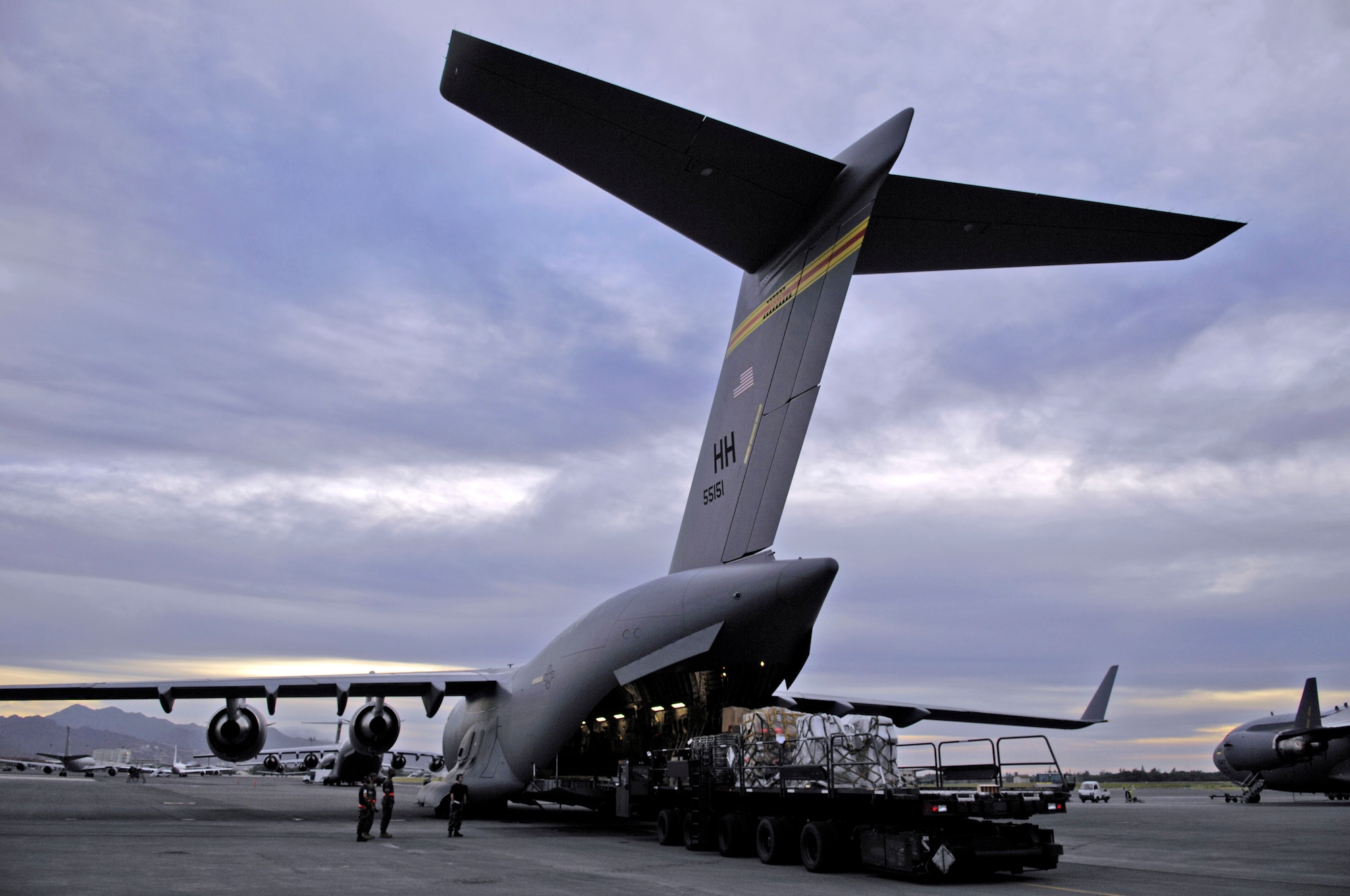 Pallets of equipment are loaded on a C-17 Globemaster III at Hickam Air Force Base, Hawaii, Nov. 29 for a mission to Vietnam. The mission includes the transport of Joint POW/ MIA Accounting Command members and deliver two ultrasound units to Thuy Duong Village, Vietnam. (U.S. Air Force photo/Tech. Sgt. Shane A. Cuomo)  
