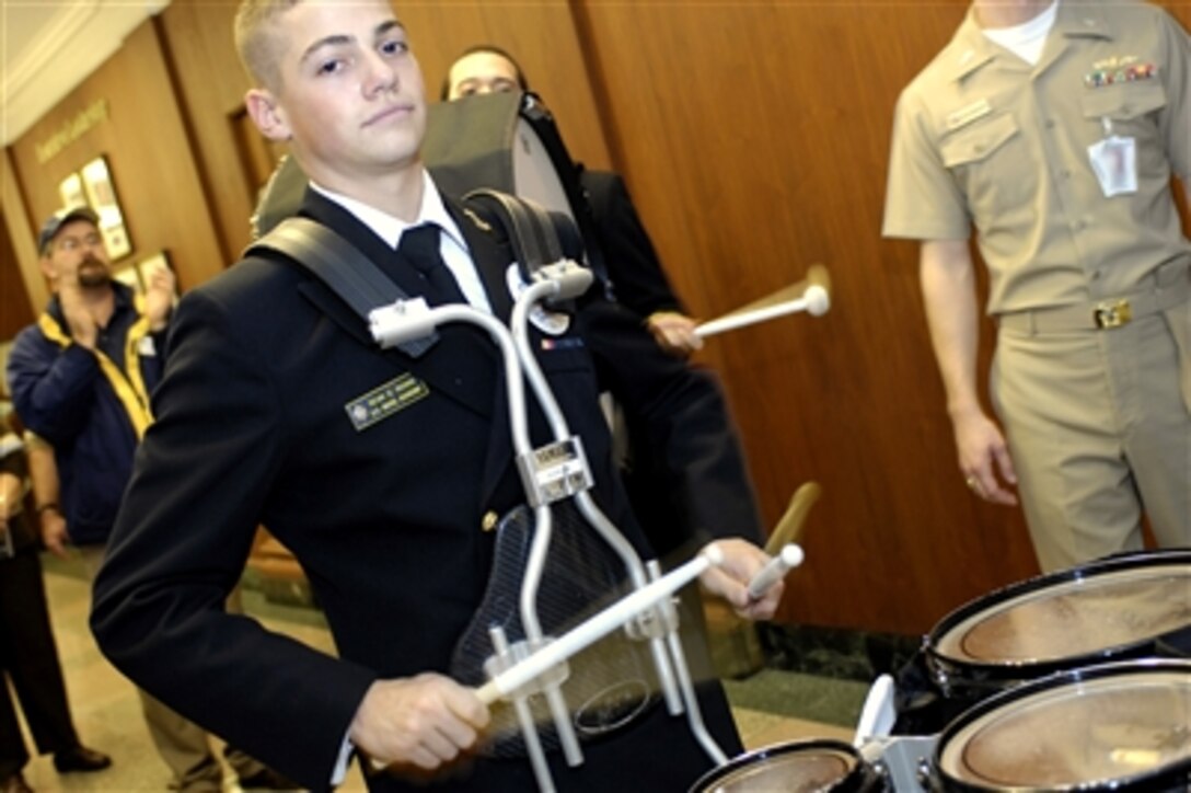 U.S. Naval Academy midshipman Sean Rooks plays his drums during a Navy pep rally at the Pentagon, Nov. 30, 2006.  The pep rally was held just days prior to the annual Army vs. Navy football game where the Black Knights and Midshipmen will duke it out at Lincoln Financial Field in Philadelphia, Dec. 2, 2006.  