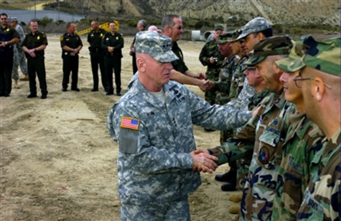 Lt. Gen. H Steven Blum, chief, National Guard Bureau, meets with citizen-soldiers and airmen and with Border Patrol agents at the U.S. border with Mexico near San Diego, Calif., on Nov. 27, 2006, during a visit to troops participating in Operation Jump Start.
