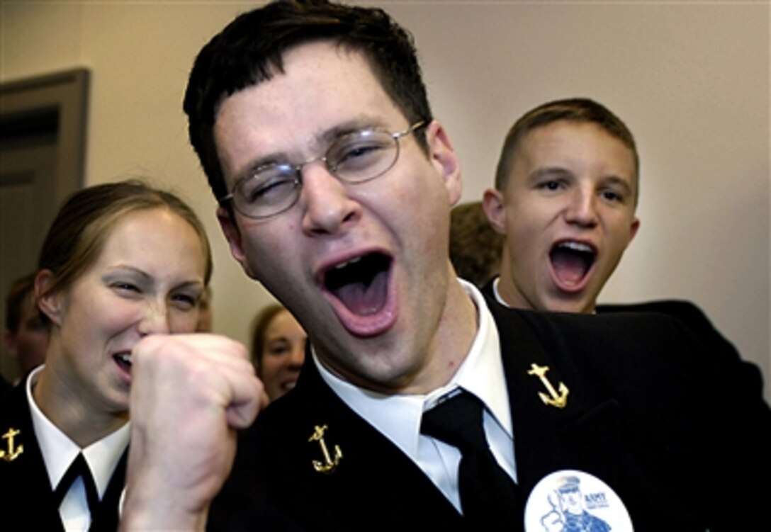 U.S. Naval Academy cadets cheer during a Navy pep rally in the Pentagon on Nov. 30, 2006.  The pep rally was held prior to the annual Army vs. Navy football game on Dec. 2, 2006, at Lincoln Financial Field in Philadelphia, Pa.  