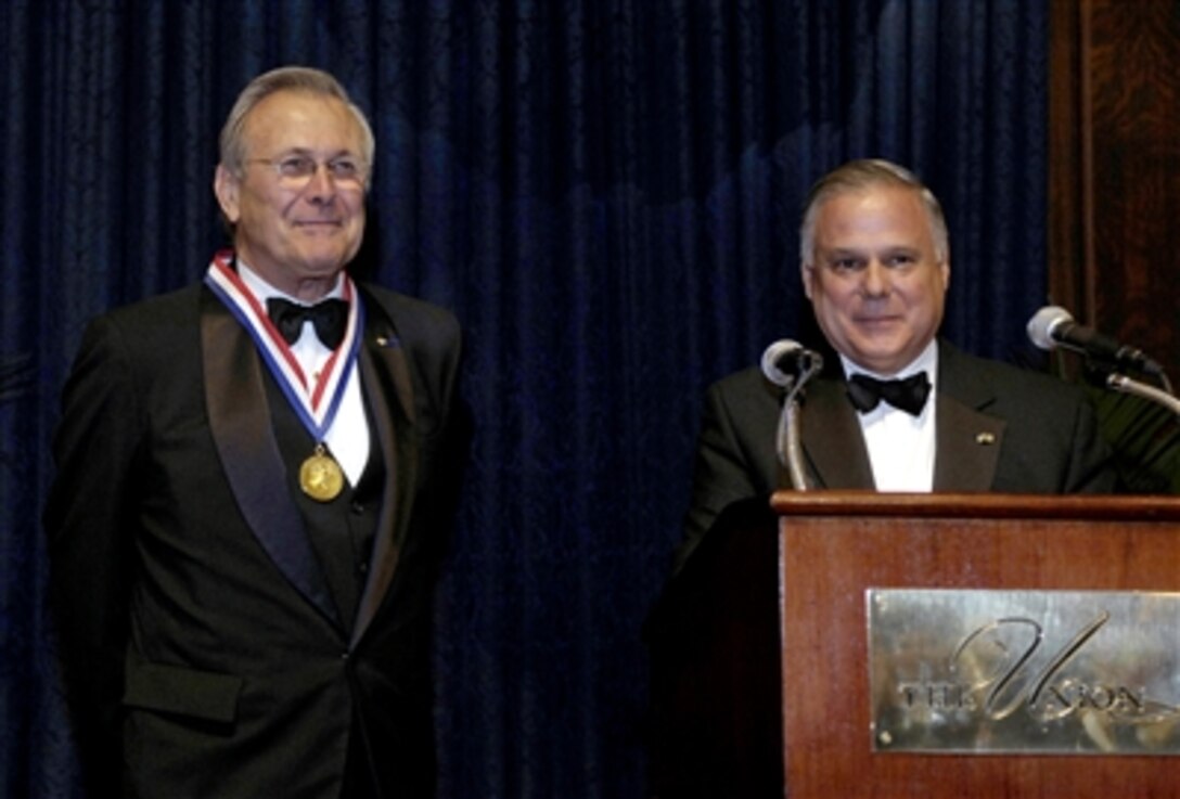 Union League President Frank Giordano introduces Gold Medal Award recipient, Defense Secretary Donald H. Rumsfeld, during a ceremony to honor him for his service to the country in Philadelphia, Dec. 1, 2006. 