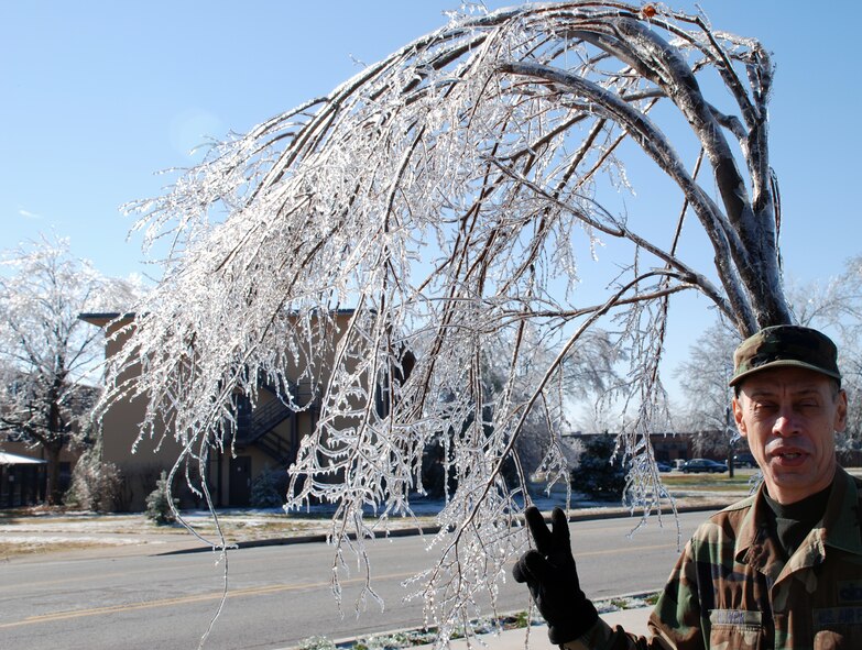 Weather changes drastically around Scott Air Force Base, and Tech Sgt. Dan Oliver sees two ice problems on trees during the December training weekend.  Some trees had broken limbs and others were uprooted by the weight of the ice on the limbs.  Photo/Tech Sgt. Gerald Sonnenberg