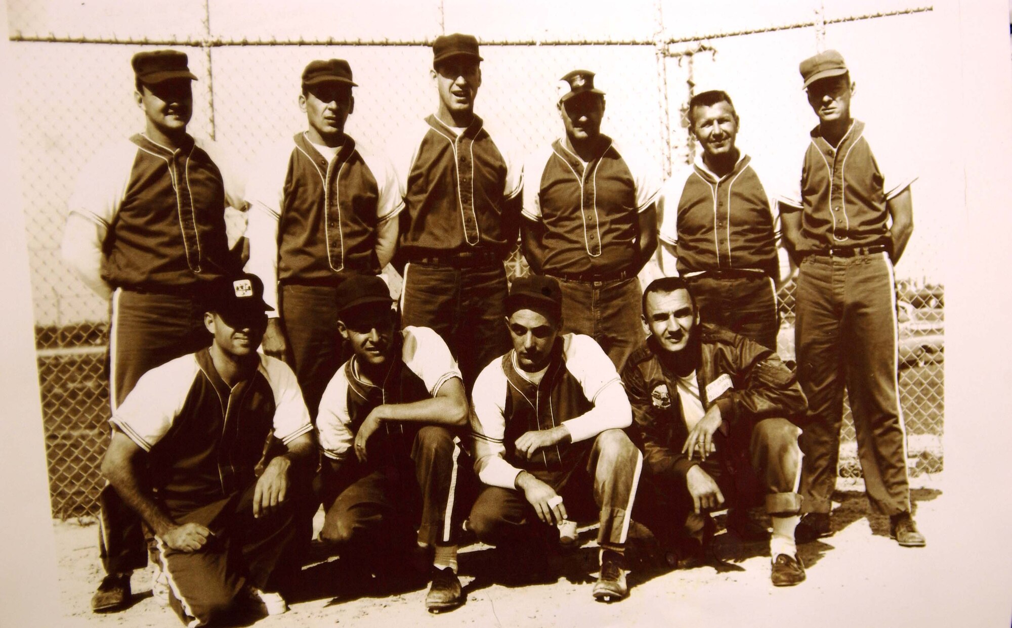 WASHINGTON D.C. -- 920th Air Refueling Squadron softball team members from the now closed  Wurtsmith Air Force Base, Mich., pose for a photograph in 1962. (Kneeling in first row, left) KC-135 pilot Capt. Robert Maddox is the father of Col. Robert Maddox, current 459th Operations Group commander. Third from left and kneeling is retired Senior Master Sgt. William Sinott. (Courtesy photo)