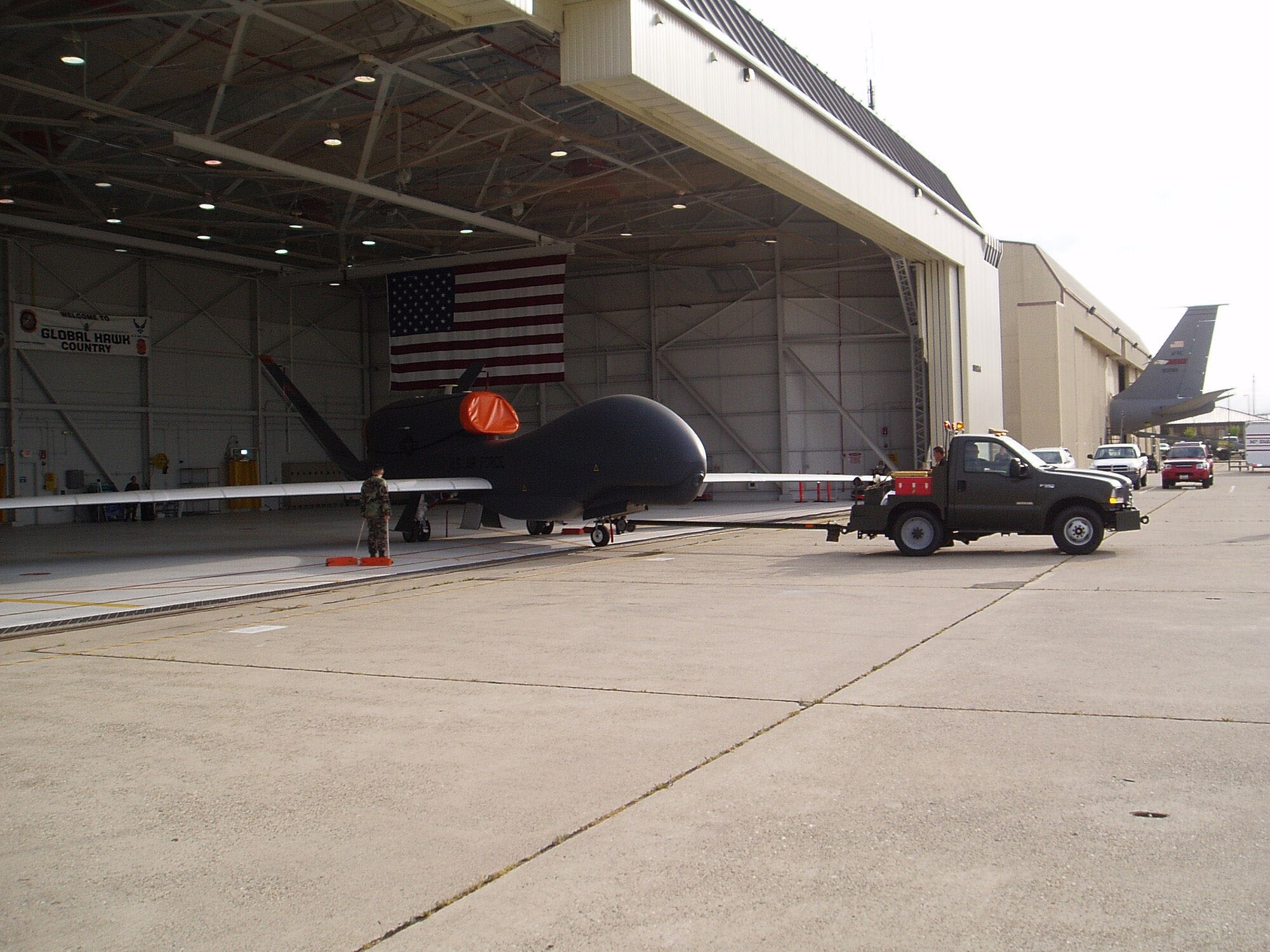 The maintainers from the 9th Reconnaissance Wing pull an RQ-4A Global Hawk Block-10 from a Beale Air Force Base, Calif., hangar as part of the operational assessment's maintenance operation. The Air Force Operational Test and Evaluation Center, Detachment 5, based at Edwards, led the operational testing of the Global Hawk that concluded Nov. 17, 2006. (Photo by Jerome Perkins)