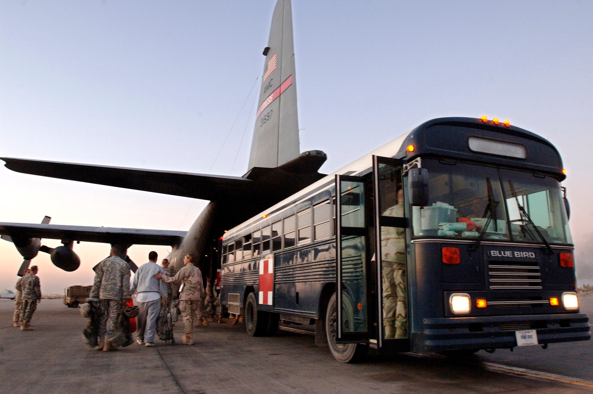 A C-130 Hercules belonging to the 379th Expeditionary Airlift Squadron and its crew of one flight nurse and two flight medics pick up patients at the 332nd Contingency Aeromedical Staging Facility during a temporary stop at Balad Air Base in Iraq. By days end, 13 patients were picked up and transported to waiting medical facilities throughout the U.S. Central Command area of responsibility. (U.S. Air Force photo/Master Sgt. Scott Wagers) 

