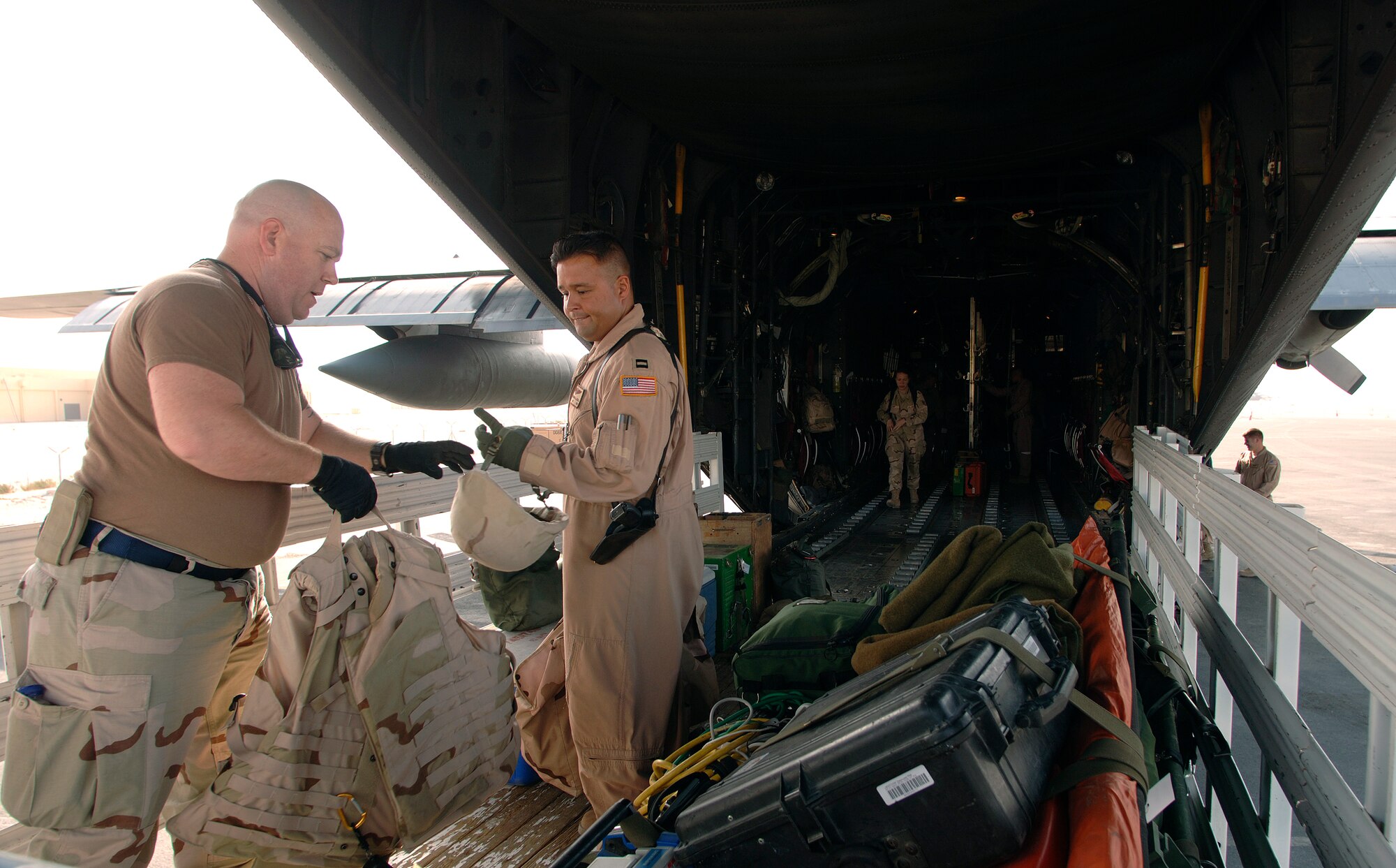 Prior to an aeromedical evacuation mission over Southwest Asia, 379th Expeditionary Aeromedical Evacuation Squadron flight nurses and flight medics load medical equipment onto a C-130 Hercules that will serve as a "flying medical clinic" for patients awaiting pick up from Iraq and Kuwait. (U.S. Air Force photo/Master Sgt. Scott Wagers) 

