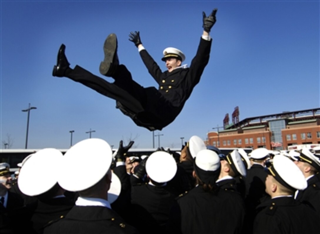 U.S. Naval Academy Midshipman Stan Jett  is thrown into the air during pre-game activities at the Army-Navy game in Philadelphia, Dec. 2, 2006. 