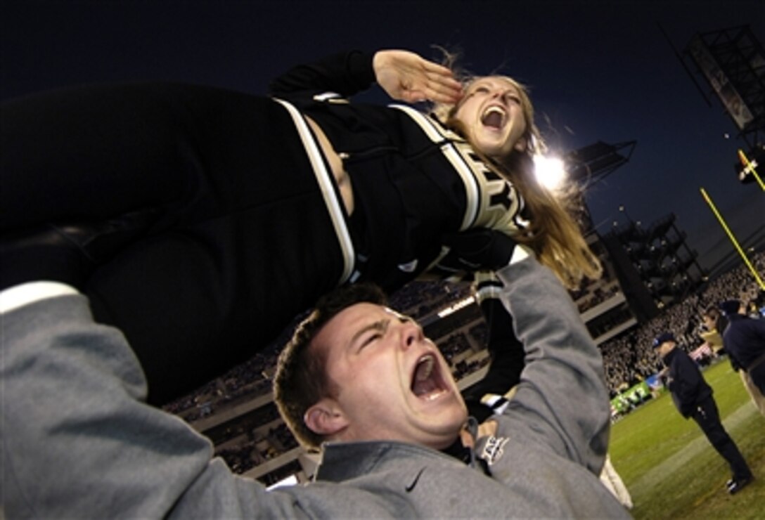 U.S. Army Military Academy cheerleaders cheer for the Black Knights football team during the 107th Army-Navy game in Philadelphia, Pa., on Dec. 2, 2006.  
