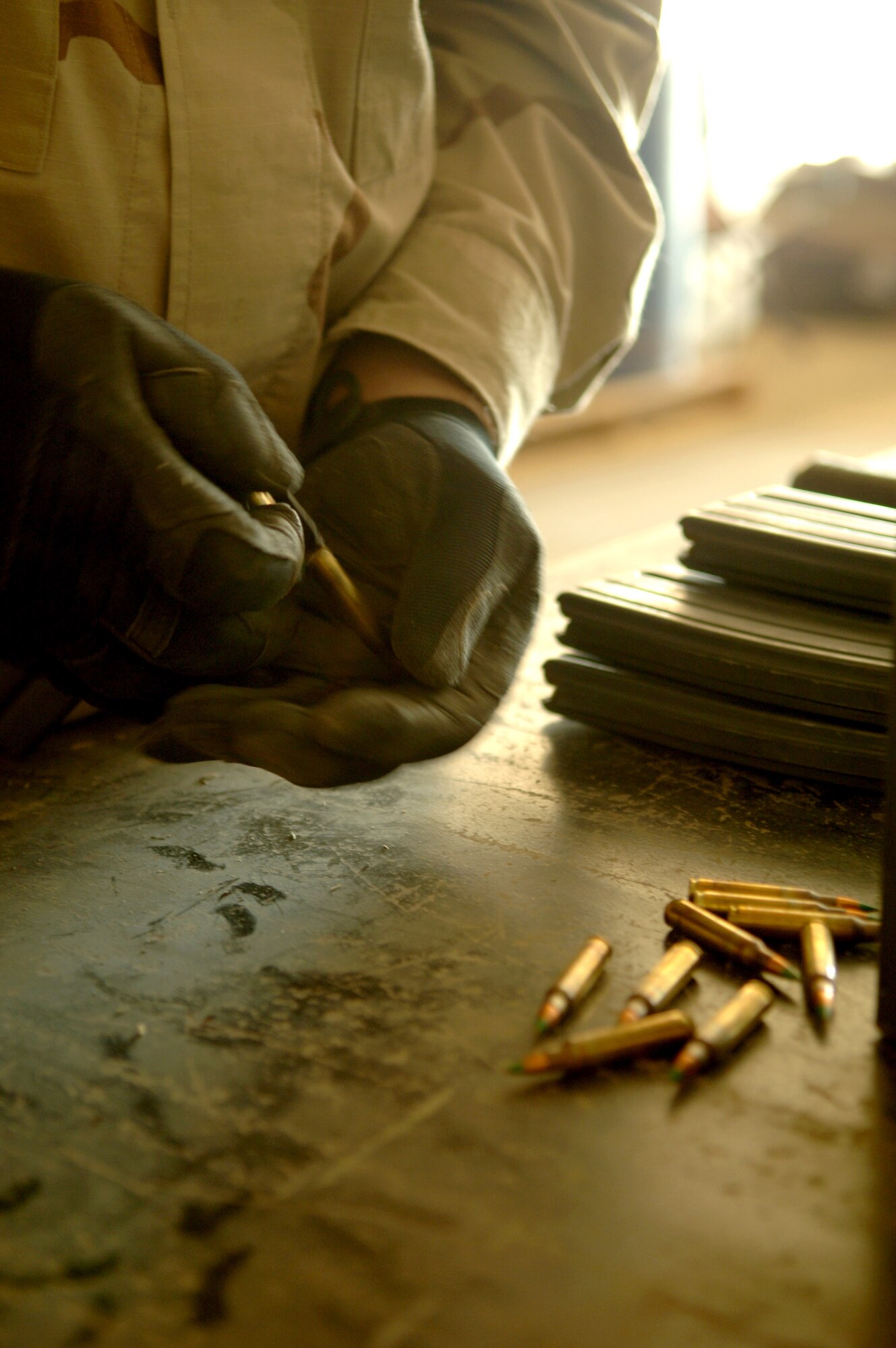 Staff Sgt. Kevin Lobstein inspects a magazine of 5.56 mm rounds for an M-16 assault rifle Nov. 29 at Balad Air Base, Iraq. Sergeant Lobstein is assigned to the 332nd Expeditionary Maintenance Squadron Ammunition Flight and is deployed out of Cannon Air Force Base, N.M. (U.S. Air Force photo/Airman 1st Class Chad M. Kellum)


