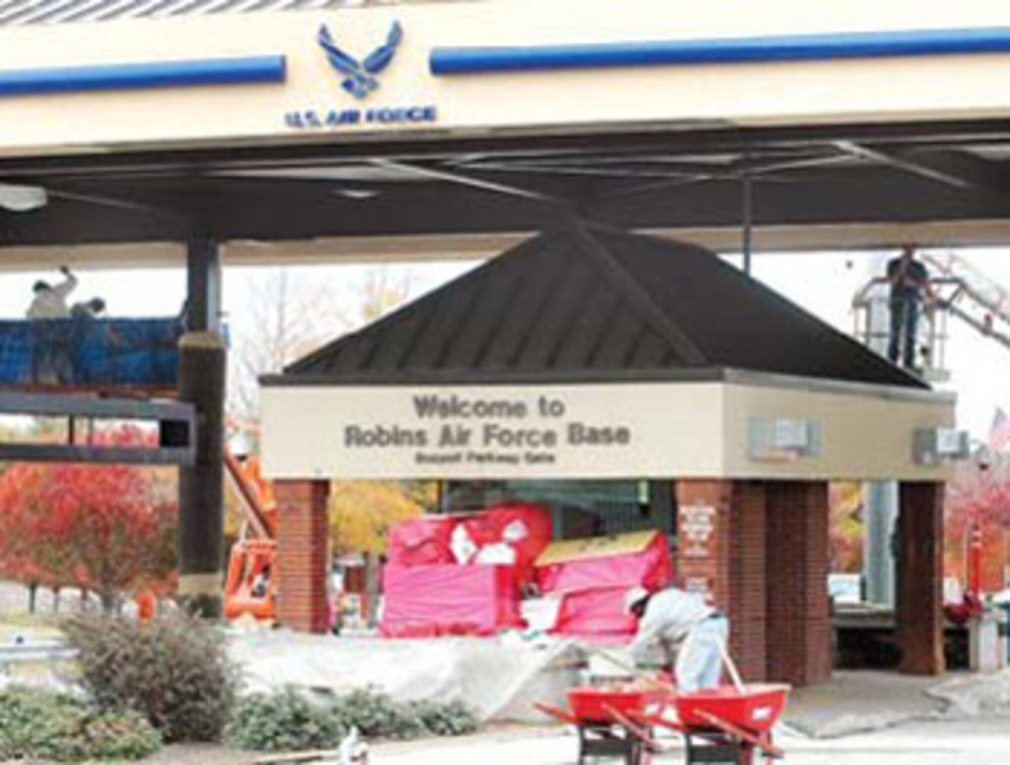 C.T. Bone Company employees work on the Russell Gate canopy construction area. The gate is scheduled to reopen next week.