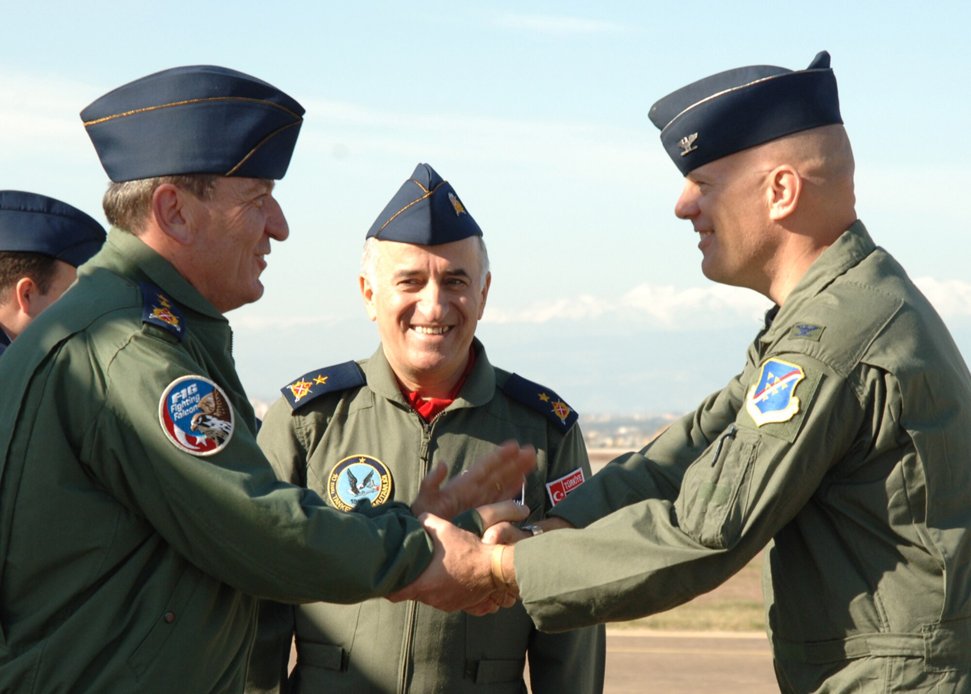 Col.l Murrell "Tip" Stinnette, left, 39th Air Base Wing commander, and Brig. Gen. M. Yilmaz Erdogan, right, 10th Tanker Command commander, greet Maj. Gen. Sefer Ozturks on arrival Dec. 5. General Ozturks arrived with members of the U.S. and Turkish Defense Economic Cooperation Agreement teams. (U.S. Air Force photo by Airman Kelly L. LeGuillon)