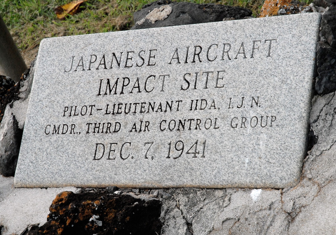 A monument marks the impact site of Japanese pilot Lt. Iida, who crashed during the 1941 attack on Pearl Harbor.  Survivors and media took part in a joint U.S. Navy/National Park Service ceremony commemorating the 65th anniversary of the attack on Pearl Harbor.  
