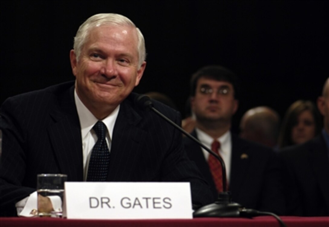 Defense Secretary nominee Robert Gates listens to a senator as he testifies before the Senate Armed Services Committee hearing regarding his confirmation in the Hart Senate Office Building in Washington, D.C. on Dec. 5, 2006.  