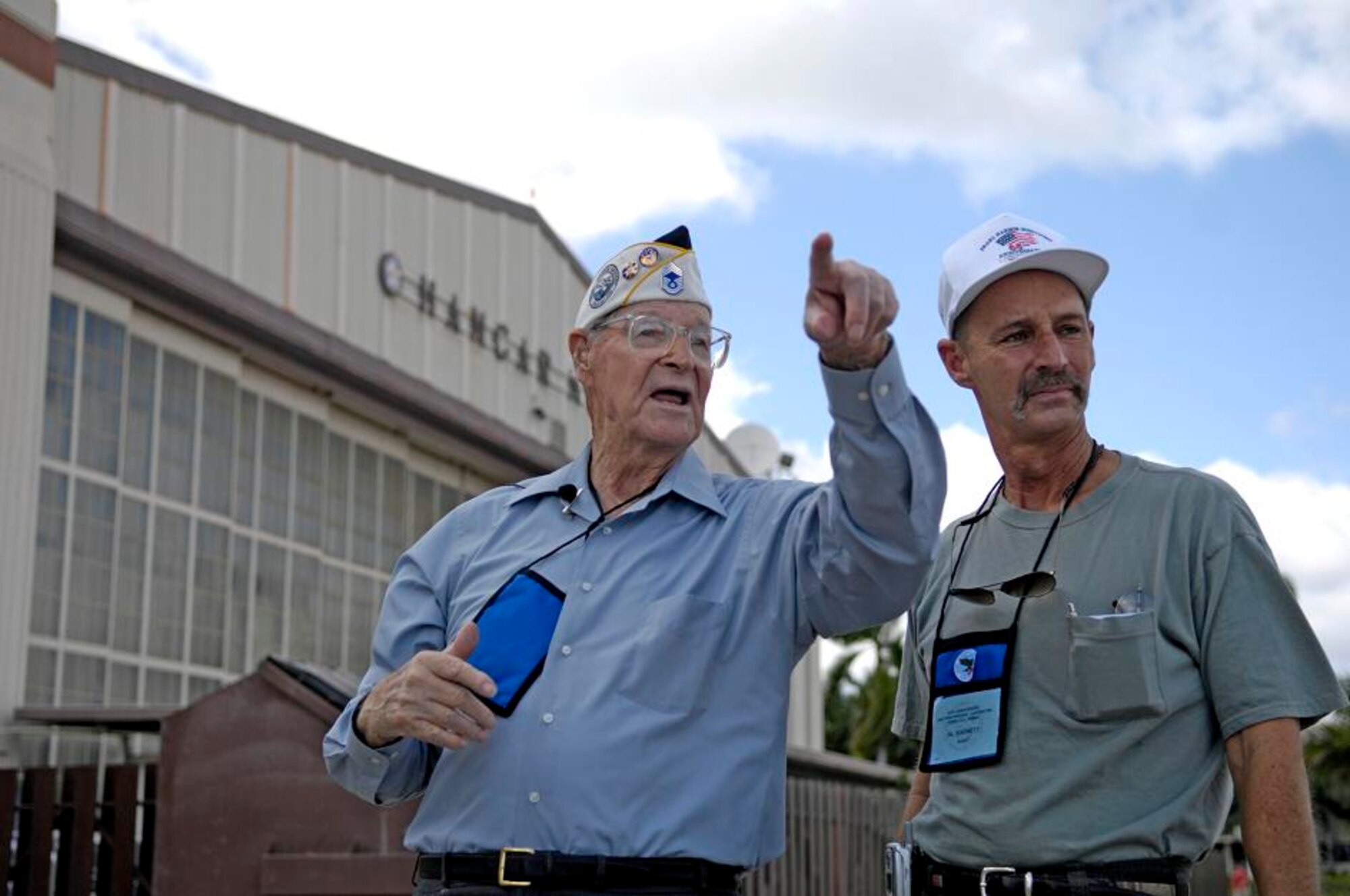 Retired Chief Master Sgt. Ralph Barnett describes landmarks to his son Al Barnett during a visit Dec. 4 to Hickam Air Force Base, Hawaii. Chief Barnett was stationed at Hickam Field as a young sergeant when the Japanese launched a surprise attack Dec. 7, 1941.  (U.S. Air Force photo/ Tech. Sgt. Shane A. Cuomo) 
