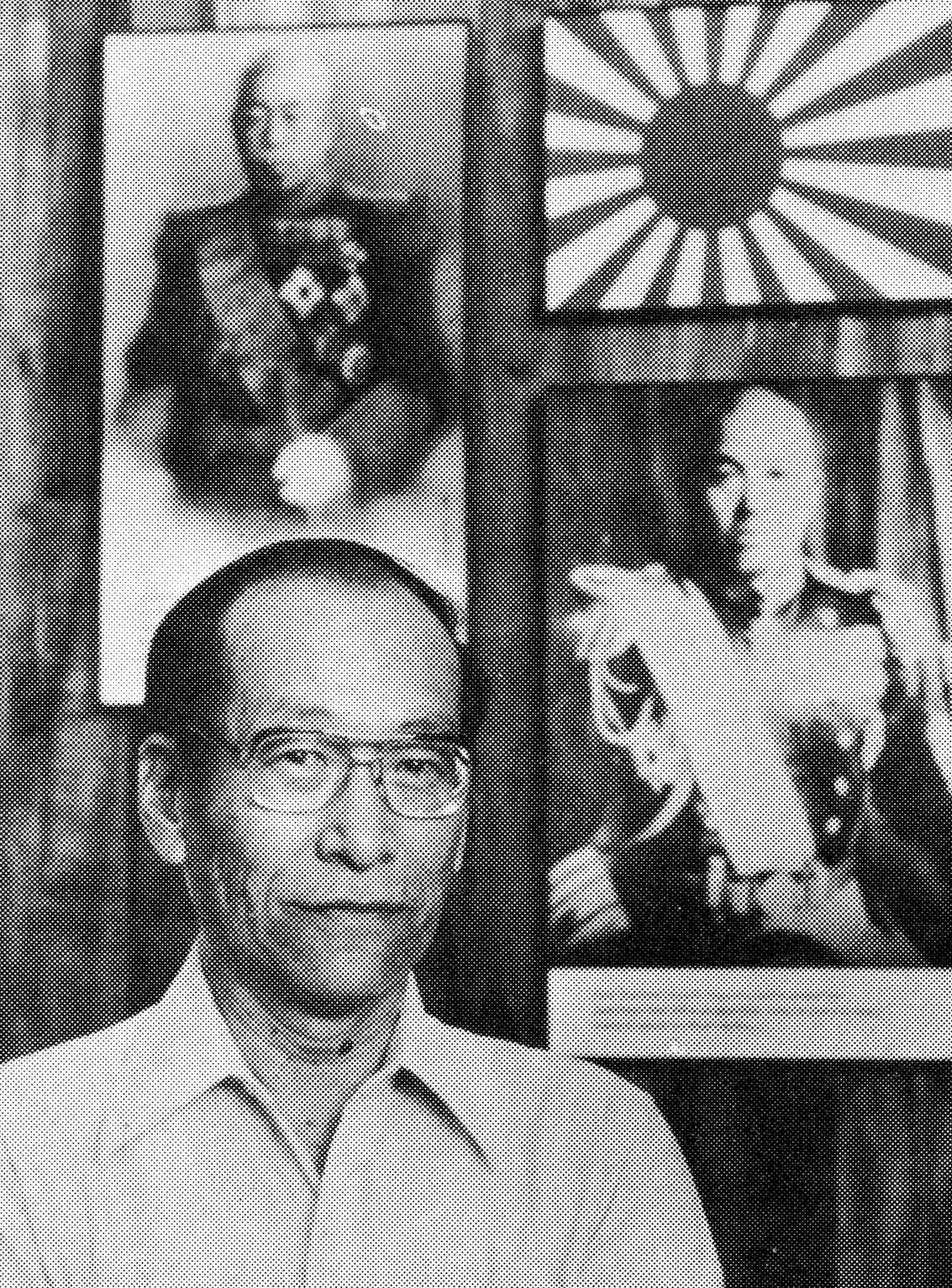 Joe Muratsuchi, an American inducted into the Japanese army, stands beneath a display of the Japanese naval flag and World War II leaders, Admiral Yamamoto (left) and Admiral Nagumo, at the Arizona War Memorial Musuem in Hawaii in 1987. (U.S. Air Force photo/Tech. Sgt. Bill Thompson)