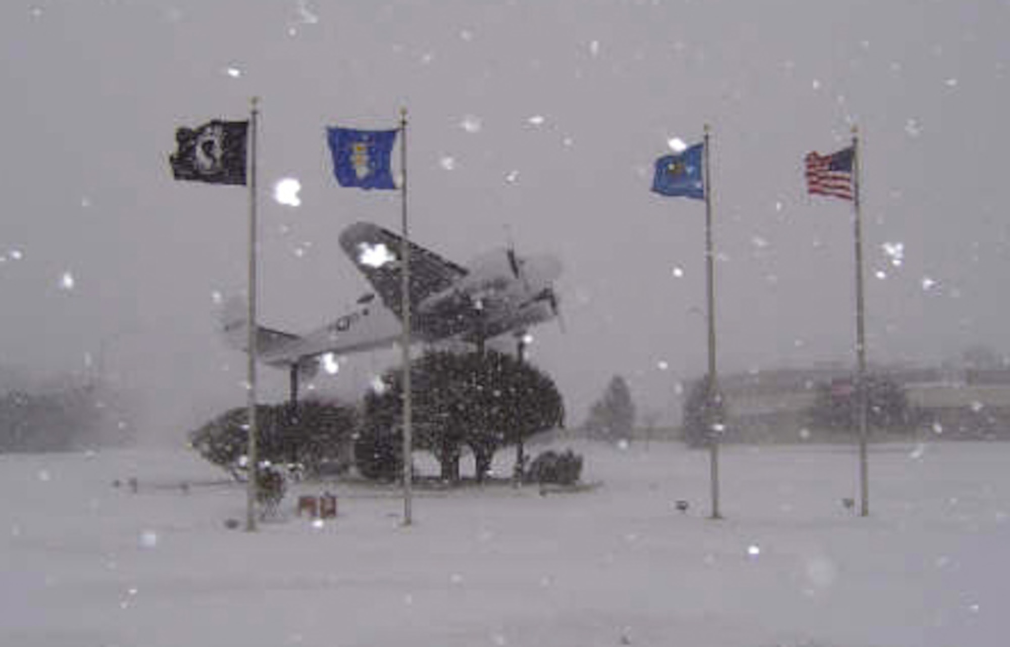 The C-45 Expediter display, located in the traffic circle here, gets a dusting of fresh snow during the blizzard Nov. 29.  At 5-1/2 inches, the first snowfall of the season broke the previous record of 3.9 inches for the month of November.  The cold front also brought in record-breaking temperatures, sinking as low as 4 degrees Friday morning.  (U.S. Air Force photo/Maj. Neal Ridge)