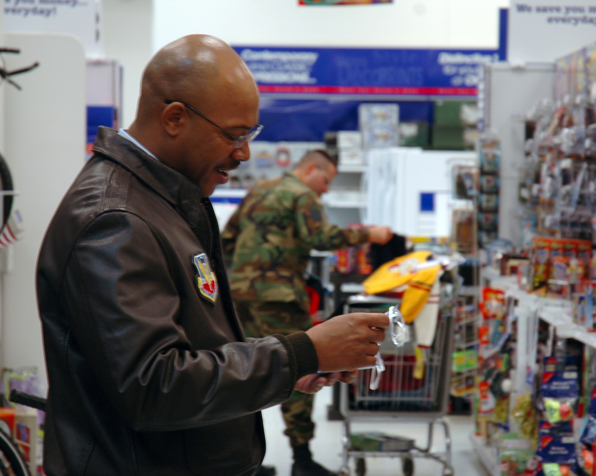 BUCKLEY AIR FORCE BASE, Colo. -- Master Sgt. Lee Frye, 566th Information Operations Squadron first sergeant, checks his tags from the Angel Tree to make sure he picks out the right gifts for the children he is shopping for. Team Buckley first sergeants and other volunteers spent approximately $4,600 donated by the Homefront Heroes Denver chapter, a non-profit military support group. The Angel Tree project provides family members of all services', E-5's and below, gifts for the holidays. (U.S. Air Force photo by Staff Sgt. Sanjay Allen)