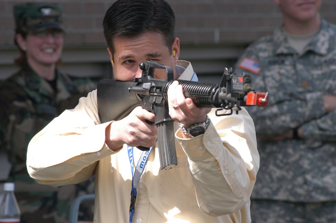 Brian Walker gets on target during an Honorary Commander's visit to the 99th Regional Readiness Command, April 20, 2006.  The Honorary Commander's Association is a community relations program developed in March 2003 by the 911th Airlift Wing, Air Force Reserve Command.