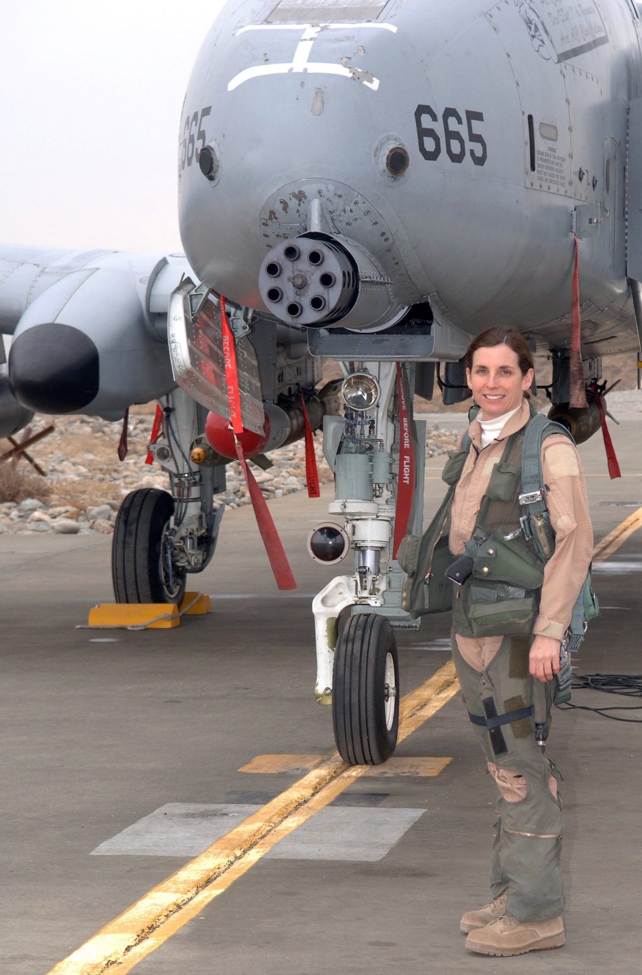 Lt. Col. Martha McSally stands with her A-10 Thunderbolt II aircraft. The colonel is the first female pilot in the Air Force to fly in combat and to serve as a squadron commander of a combat aviation squadron. (U.S. Air Force photo)
