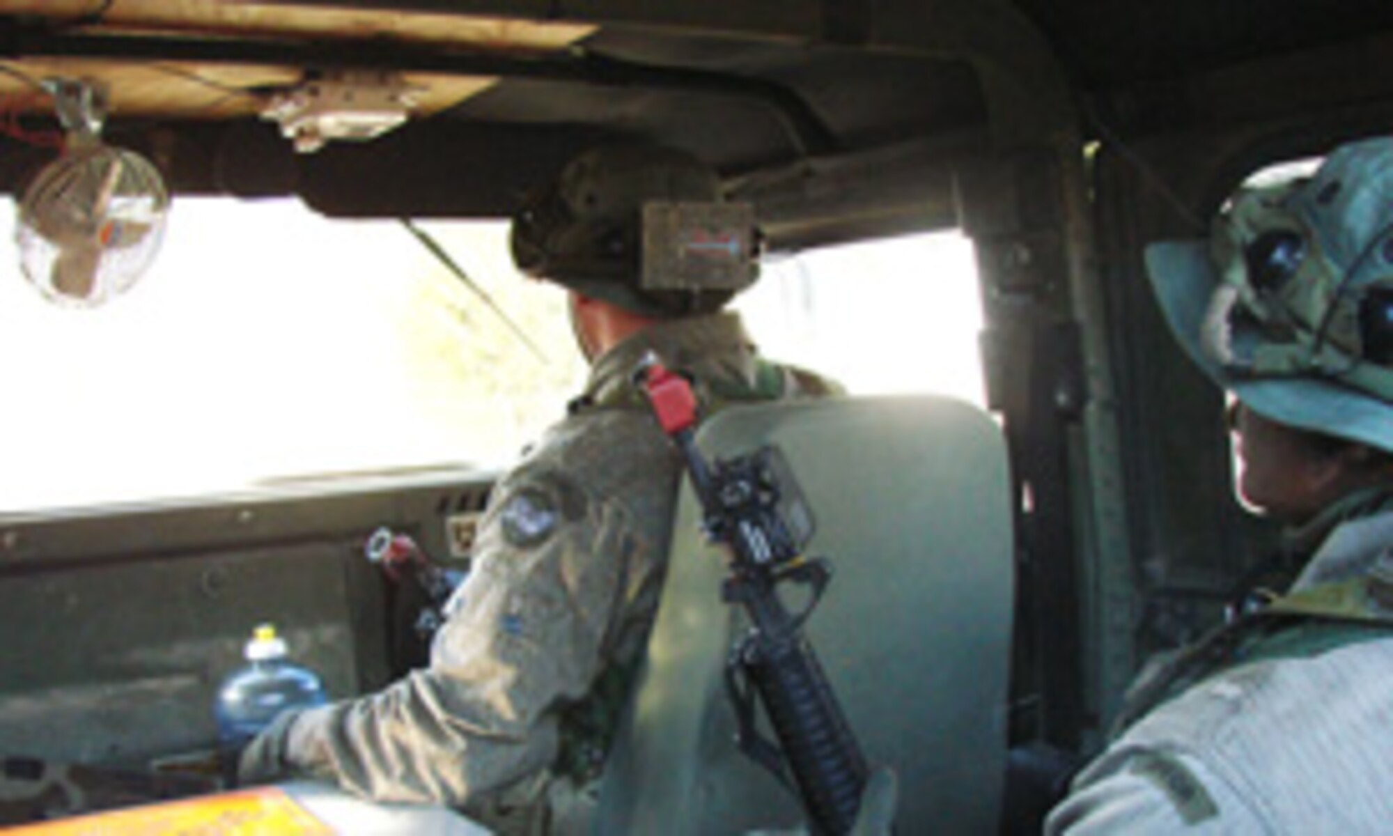 (Photo by 2nd Lt. James Justice) Armed Opposing Force await in their Humvee to mount an attack on a  Combat Readiness Course convoy during the four-day training at Kegelman Auxiliary Field.