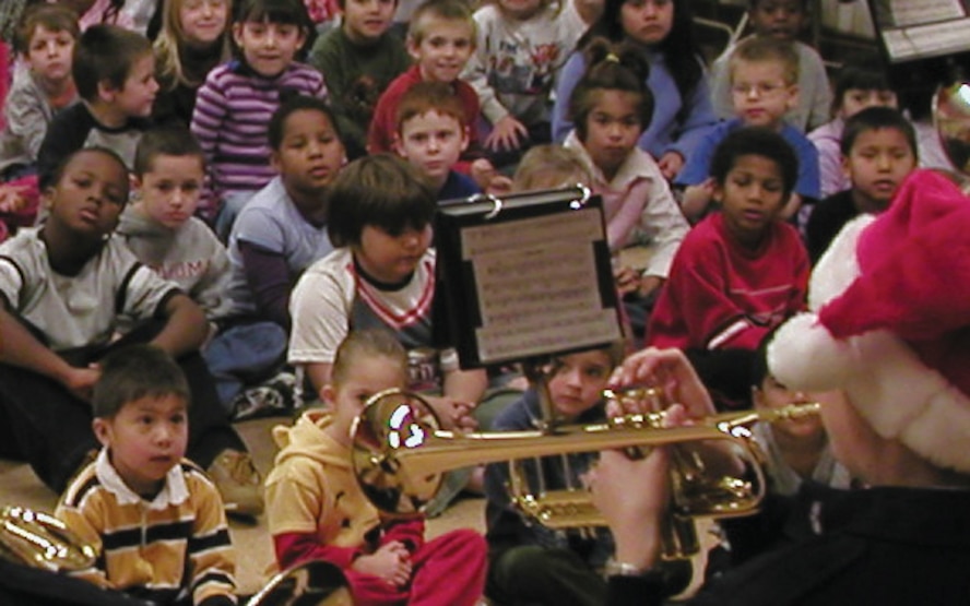 (Photo by Bob Farrell) Members of the Band of Mid-America from Scott Air Force Base, Ill., entertain students at Monroe Elementary School in Enid Wednesday. The band performed at Garfield Elementary, Monroe, the Enid Board of Education and the 71st Flying Training Wing headquarters building during their visit.