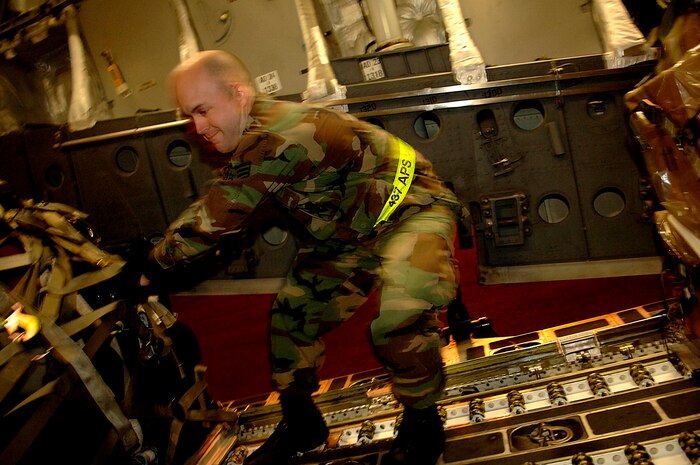 Staff Sgt. Stephen Wright, 437th Aerial Port Squadron, Charleston Air Force Base, S.C., loads a pallet of luggage onto a  C-17 Globemaster III.  The 437th APS hosts the World Wrestling Entertainment, Inc. stars and crew before a flight to Ramstein Air Base, Germany, Dec. 5, 2006. The WWE is performing for troops deployed overseas during a holiday tour put together by Armed Forces Entertainment. This will be the fourth time the WWE has teamed with Armed Forces Entertainment to entertain deployed troops.


(RELEASED)(U.S. Air Force photo by Airman 1st Class Nicholas Pilch)